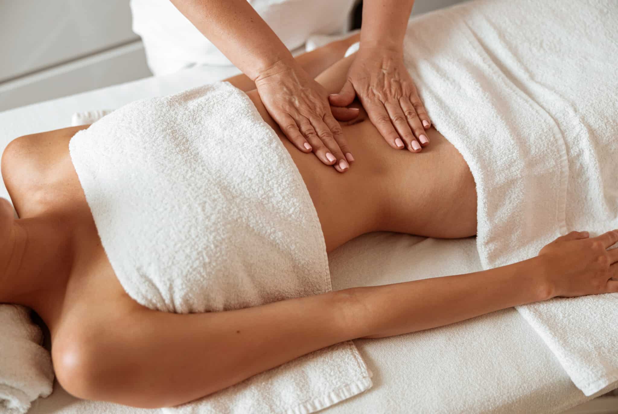 Female receiving abdominal massage. Image used under license from Shutterstock.com